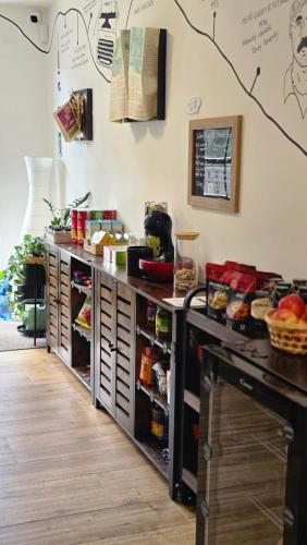 a kitchen with a counter with lots of food at Bylo Nebylo apartmány in Vítkovice