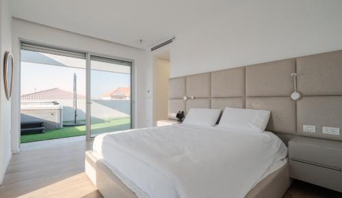 En eller flere senge i et værelse på Olga Resort - אולגה ריזורט