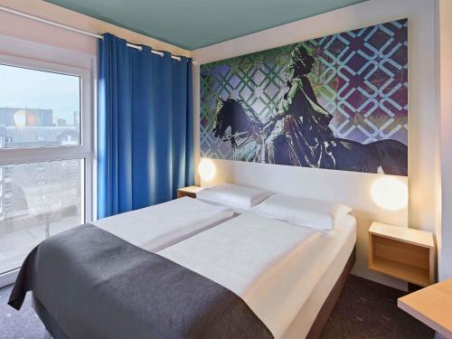 Postel nebo postele na pokoji v ubytování B&B Hotel Dortmund-City