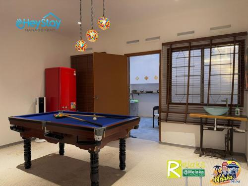 a living room with a pool table in it at MalayaVilla 5R3B16Pax PrivatePool Karaok PlayGround in Gua Sai