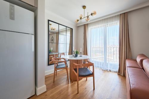 a living room with a table and a couch at Taksim Lagirio Residence in Istanbul