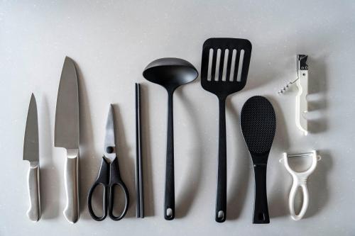 a group of kitchen utensils sitting on top of a counter at Violet Garden in Furano