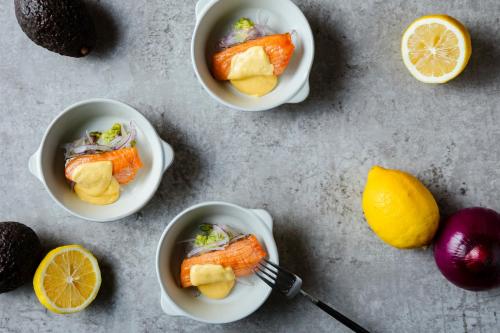 a table with three bowls of food with oranges and lemons at HOTEL GRANVIA HIROSHIMA SOUTH GATE in Hiroshima