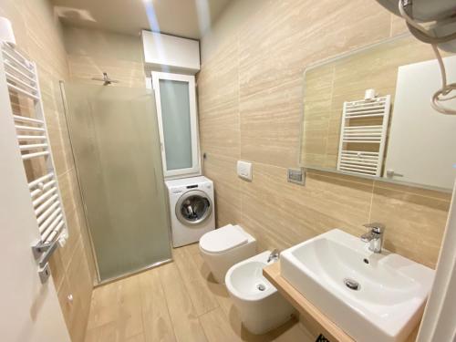 a bathroom with a sink and a toilet and a shower at Dreamhouse B&B in Pioltello