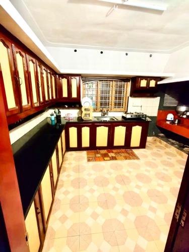 a kitchen with a sink and a counter top at ARABIAN HOLIDAY RESORT WITH SWIMMING POOL IN IDUKKI Calvary Mount in Idukki