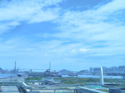 a view of a city with a river and a bridge at Busan Station KTX 30s Ocean View 부산역ktx 30초 오션뷰 in Busan