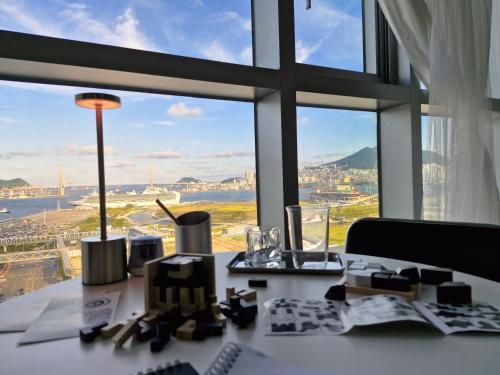 an office desk with a view of a city at Busan Station KTX 30s Ocean View 부산역ktx 30초 오션뷰 in Busan