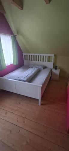 Кровать или кровати в номере Ferienhaus Meinheim