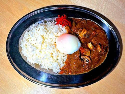 a black plate of food with rice and meat at APA Hotel Omori Ekimae Higashi in Tokyo