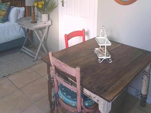 a wooden table with a stroller on top of it at Nouvelle Vie Self-catering Accommodation in Reebok