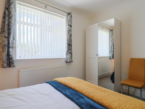 Ένα ή περισσότερα κρεβάτια σε δωμάτιο στο Cedar Drive