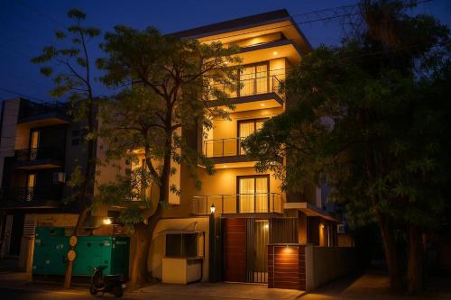 a large building with lights on the side of it at Hotel Admire Inn Sector-50 by ASPL in Noida