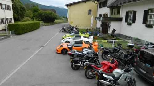 a row of motorcycles parked in a parking lot at Gasthof Hochalmspitze in Malta