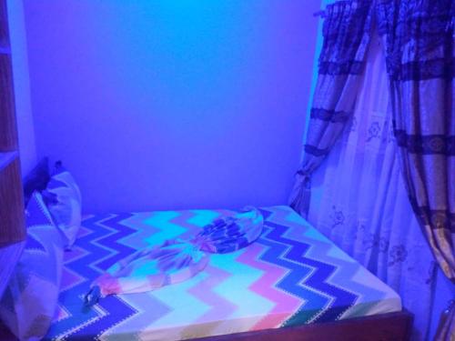 Ein Bett oder Betten in einem Zimmer der Unterkunft Le Centurion