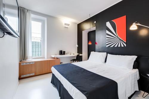 Cama o camas de una habitación en Sora Luxury Inn