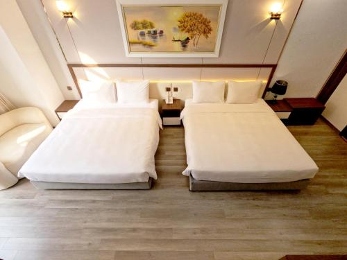 Ένα ή περισσότερα κρεβάτια σε δωμάτιο στο Halong Lavender Hotel