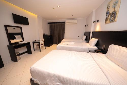 Helio Cairo Hotelにあるベッド