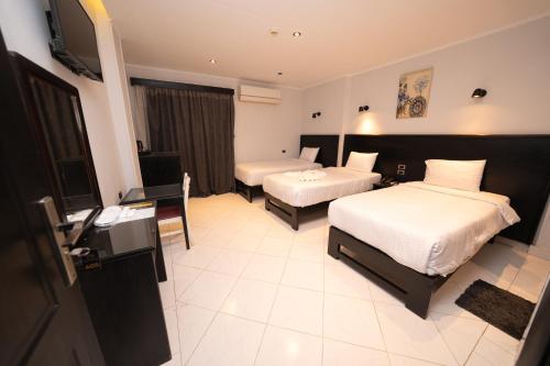 Helio Cairo Hotelにあるベッド