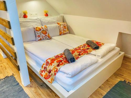 Postel nebo postele na pokoji v ubytování Magenta Apartman