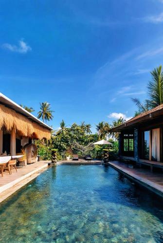 a swimming pool in a villa in a resort at Tattva Ubud Retreat & Wellness in Ubud