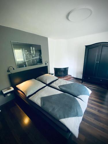 a bedroom with a large bed in a room at Ferienwohnung Paradies Hella in Kippenheim