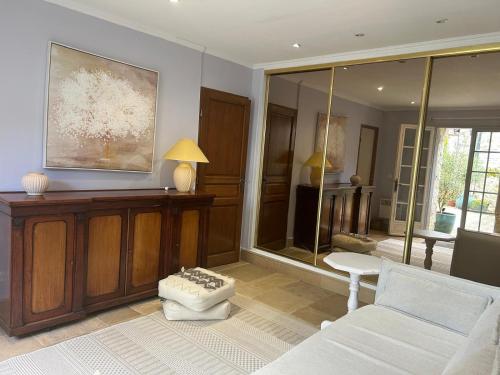 a living room with a couch and a table at Domaine Chapelle in La Chapelle-la-Reine