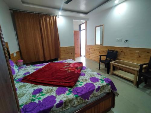 The Tushar Homestayにあるベッド