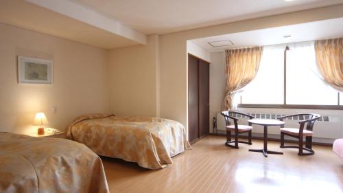 Katil atau katil-katil dalam bilik di Kidoike Onsen Hotel