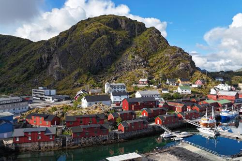 an aerial view of a small town with a mountain at Stamsund Authentic Rorbu in Stamsund