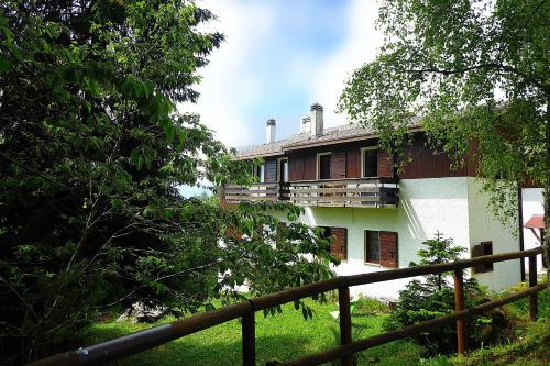 a building with a fence in front of it at Chalet Giove in Belluno