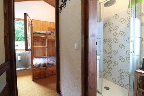 a hallway with a room with bunk beds and a door at Chalet Giove in Belluno