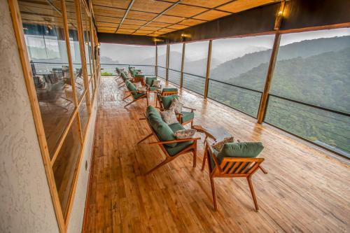 a row of chairs and tables on a cruise ship at Burunga Gorilla Lodge in Kisoro