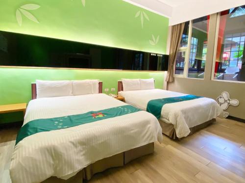 Ein Bett oder Betten in einem Zimmer der Unterkunft 明山森林會舘 The M Village