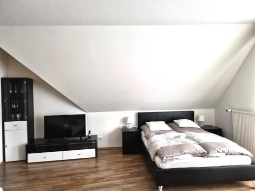 Ένα ή περισσότερα κρεβάτια σε δωμάτιο στο Das Nest Boardinghouse Hamburg Niendorf