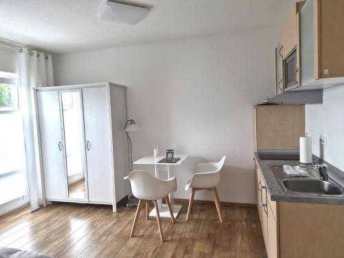Η κουζίνα ή μικρή κουζίνα στο Das Nest Boardinghouse Hamburg Niendorf