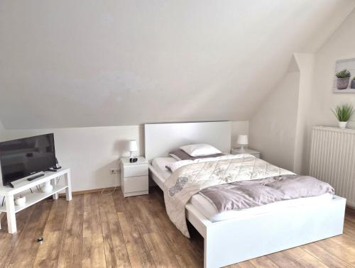 Ένα ή περισσότερα κρεβάτια σε δωμάτιο στο Das Nest Boardinghouse Hamburg Niendorf