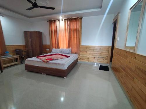 The Tushar Homestayにあるベッド