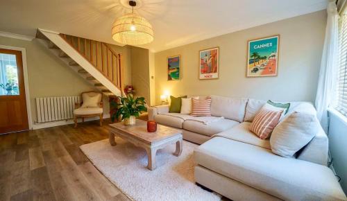a living room with a couch and a table at 2 Bed Family Home - The Retreat in Plymouth