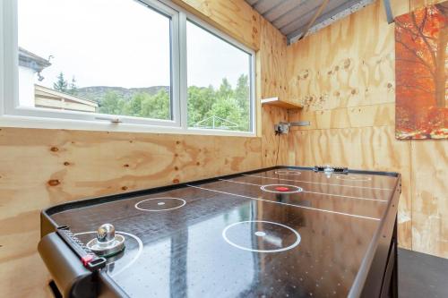 a kitchen with a glass counter top with a window at 2 Bed in Newtonmore oc-d32413 in Newtonmore