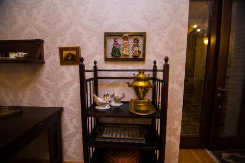 a room with a table with a lamp on a wall at Bloom Boutique Hotel in Tbilisi City