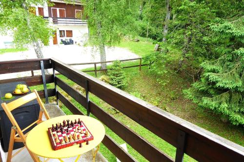 a cake on a table on a balcony at Chalet Giove in Belluno