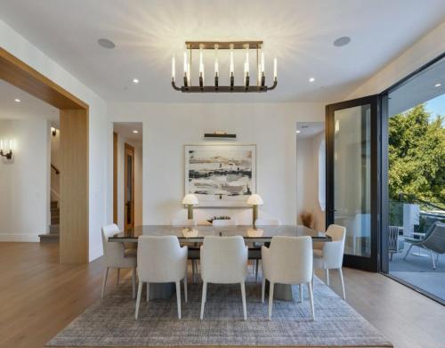 a dining room with a table and chairs at Dume Malibu in Malibu