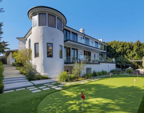 a house with a putting green in front of it at Dume Malibu in Malibu