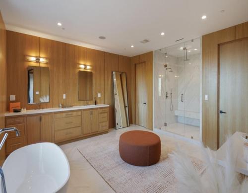 a bathroom with a tub and a toilet and a sink at Dume Malibu in Malibu