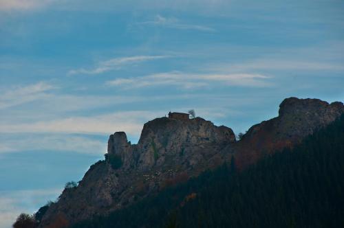 a mountain with a house on top of it at Gorosarri in Escoriaza