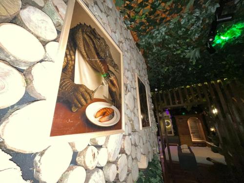 a picture of a plate of food on a stone wall at Jungle Room Jacuzzi Ambiance Tropicale in Épernay