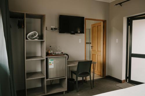 Μια τηλεόραση ή/και κέντρο ψυχαγωγίας στο Stone Olive Guesthouse