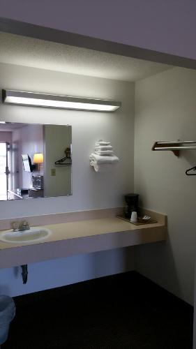 a bathroom with a sink and a mirror at Hoosier Inn- Portland in Portland