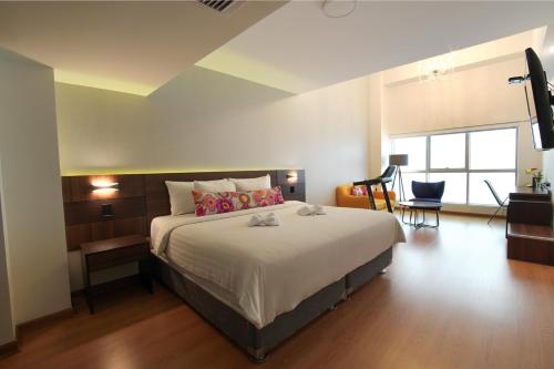 Ένα ή περισσότερα κρεβάτια σε δωμάτιο στο Hotel Britania Crystal Collection