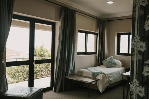 Ένα ή περισσότερα κρεβάτια σε δωμάτιο στο Stone Olive Guesthouse